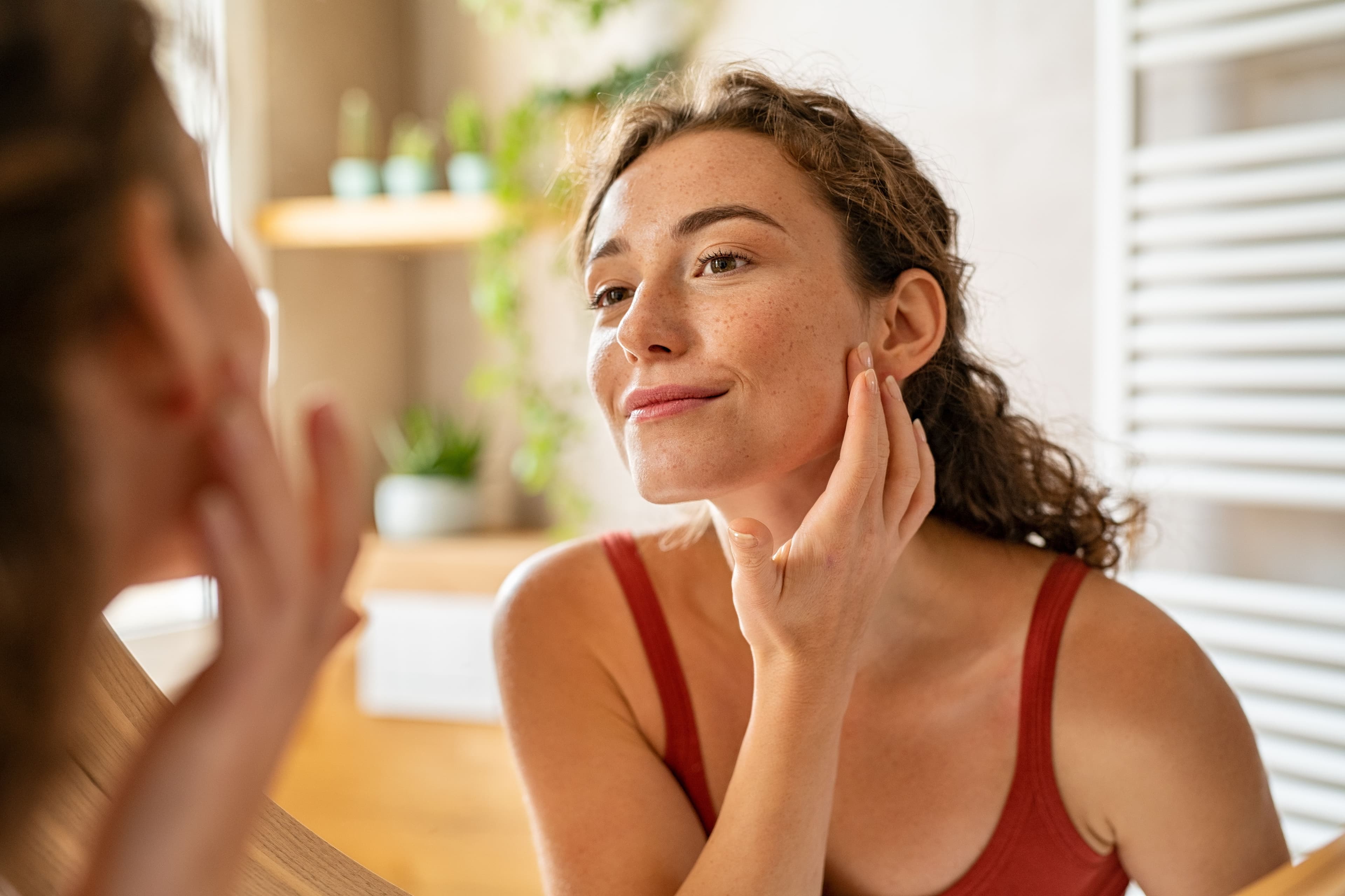 female patient looking in mirror | Image Credit: © Rido - stock.adobe.com