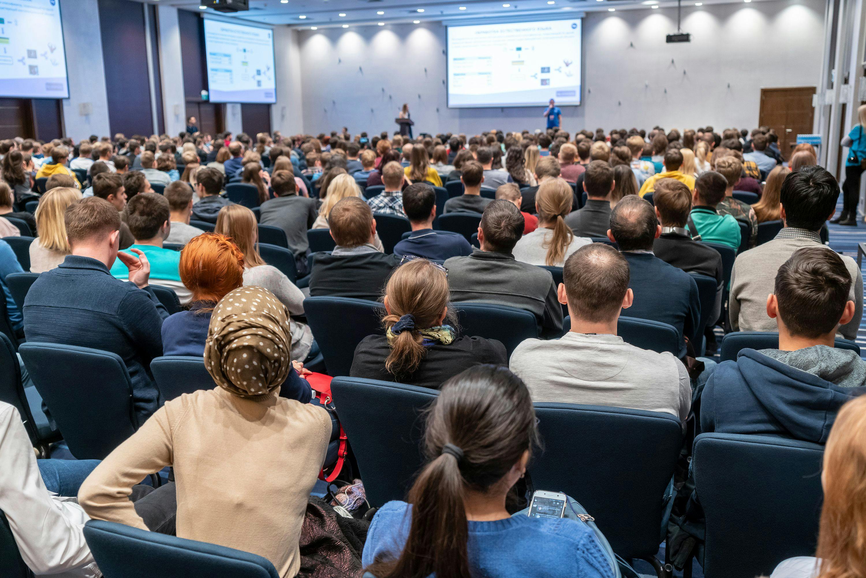 Diverse crowd sitting in conference seminar | Image Credit: © borisblik - Adobe Stock
