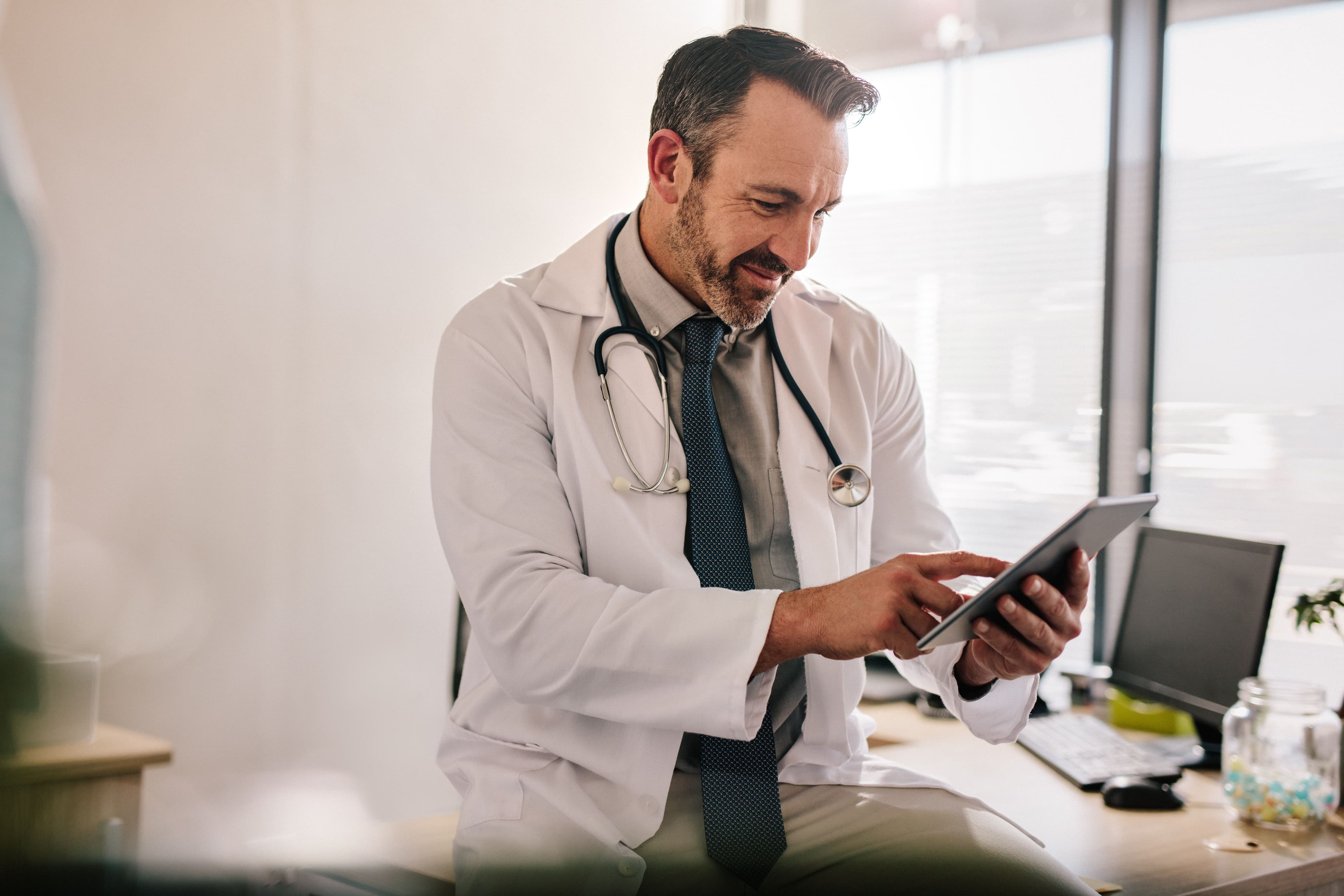 Doctor using tablet | Image Credit: © Jacob Lund - stock.adobe.com