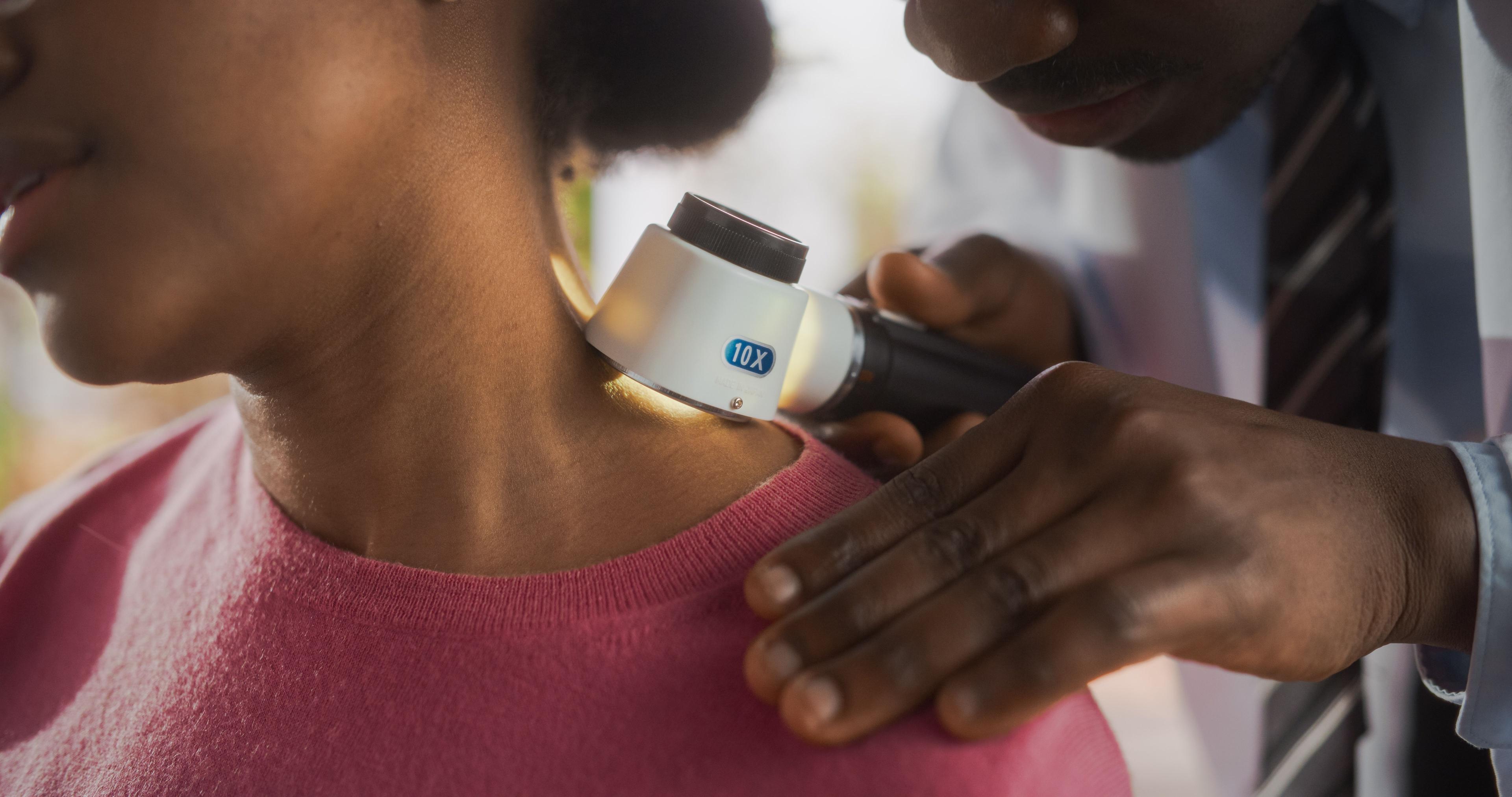 Physician assessing patient's skin | Image Credit: © Gorodenkoff - stock.adobe.com