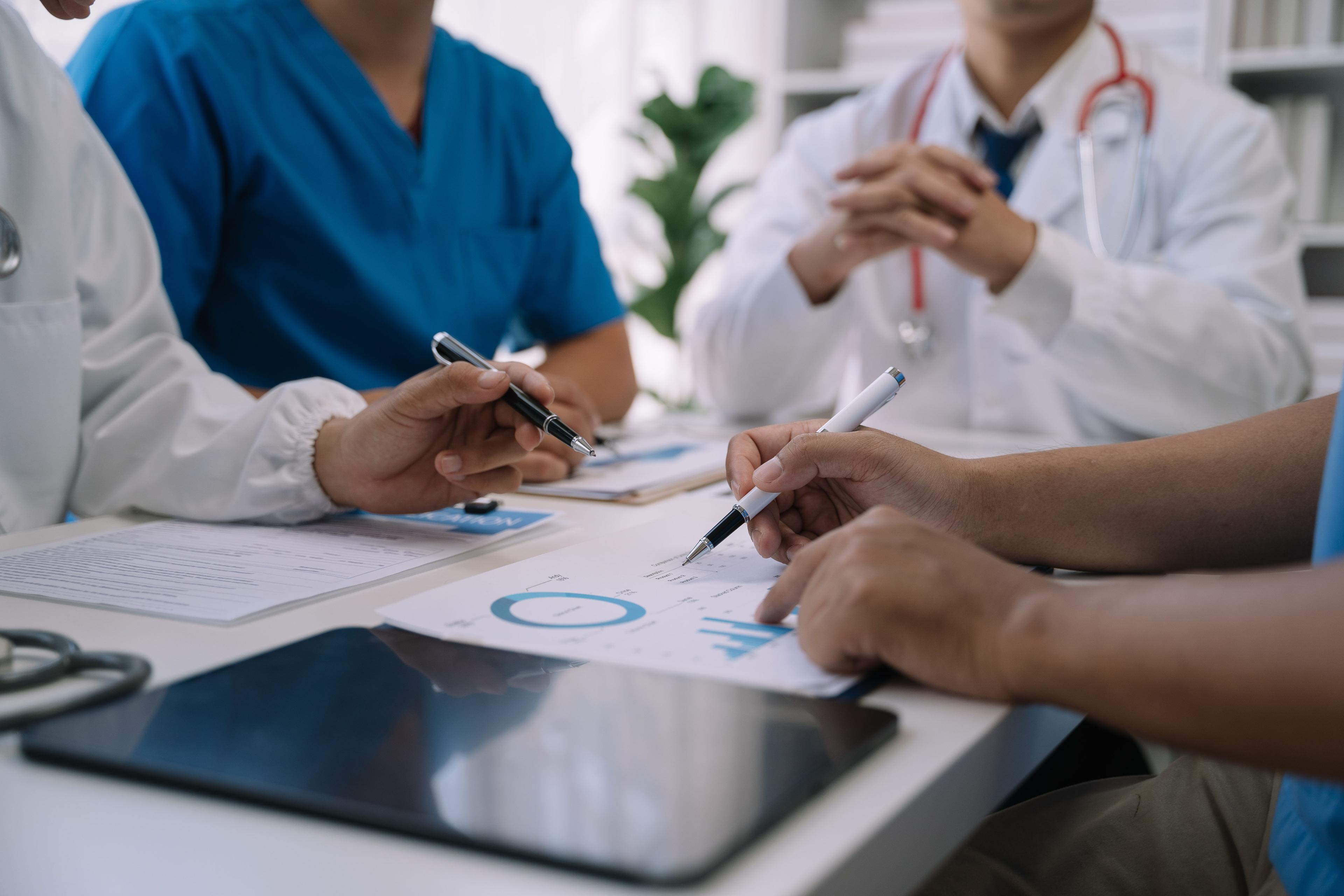 Doctors discussing taxes | Image credit: © NINENII - stock.adobe.com